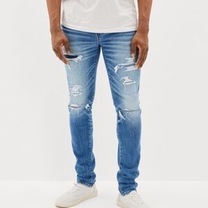 AE OUTFITTERS NEXT LEVEL SLIM AIRFLEX+ PATCHED DISTRESSED JEAN